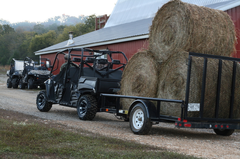 Gray Classic Crew pulling Trailer with three haybales